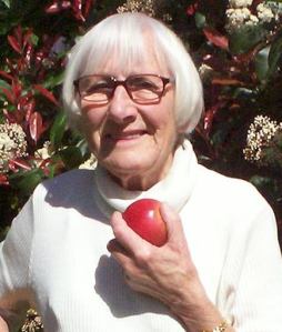 Betty Holding apple, close up